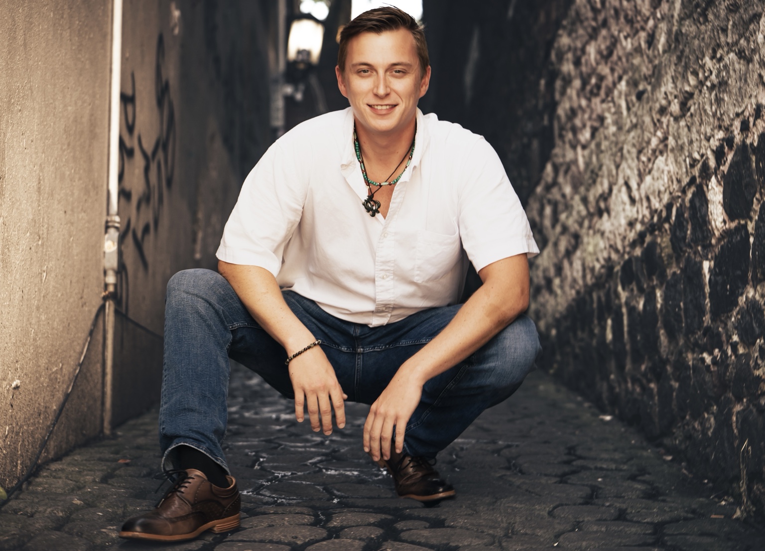 Mark Brown in a cobblestone alley